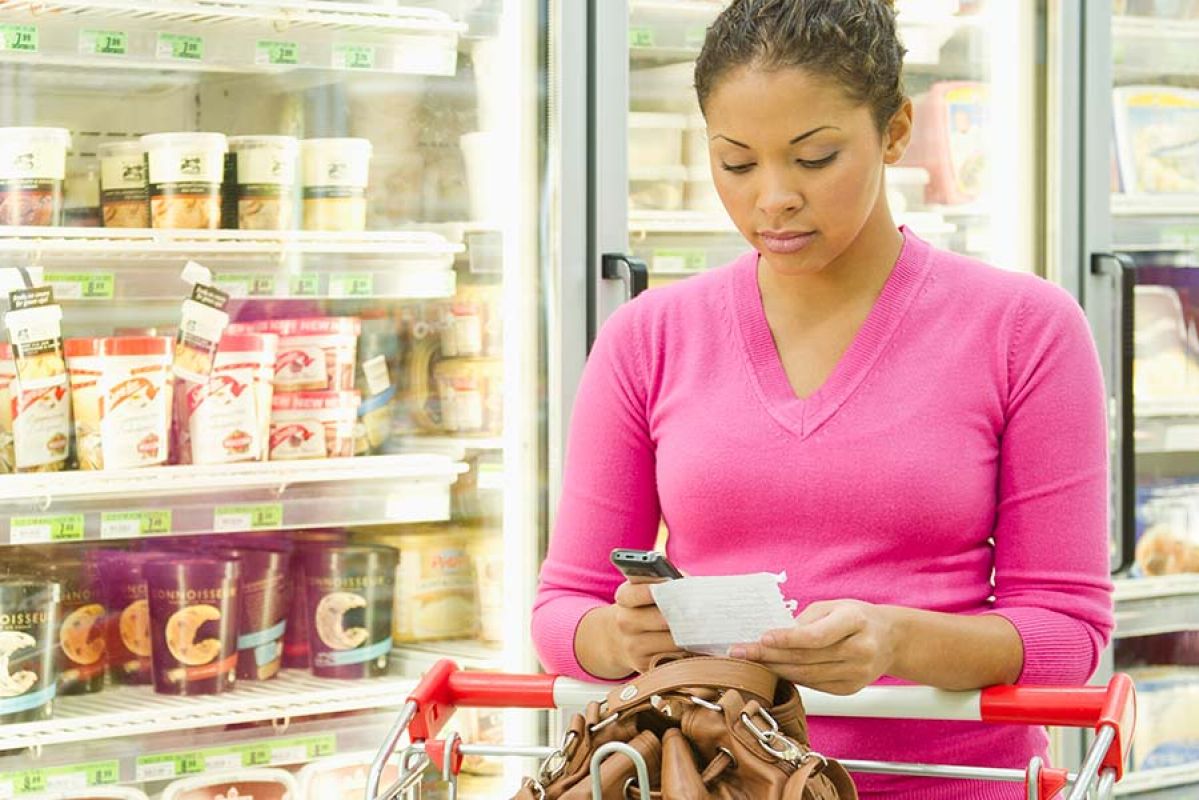 Person looking at grocery receipt